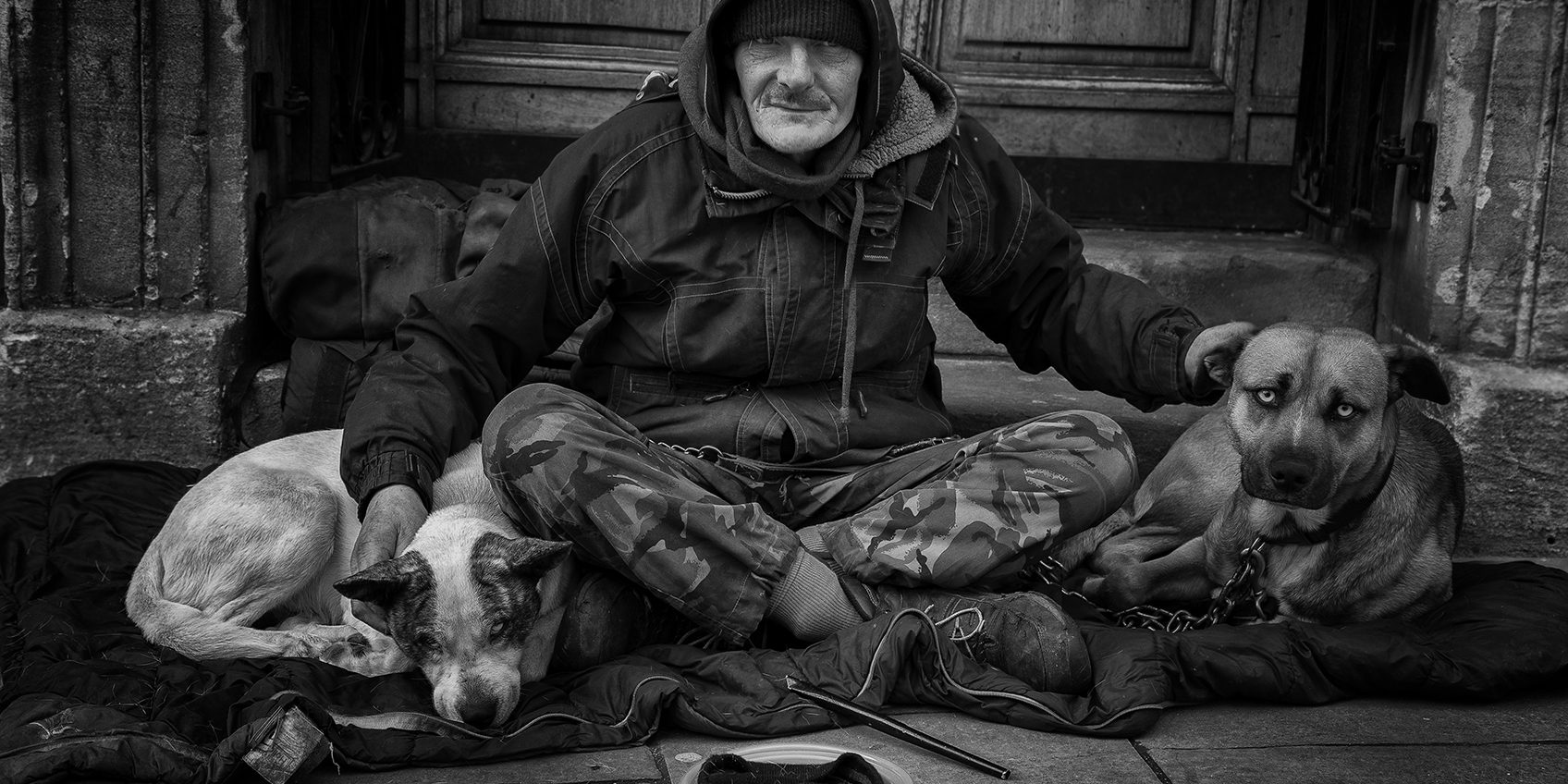 16118793007_659810d918_o A street person on the streets of Bath with his two companion dogs