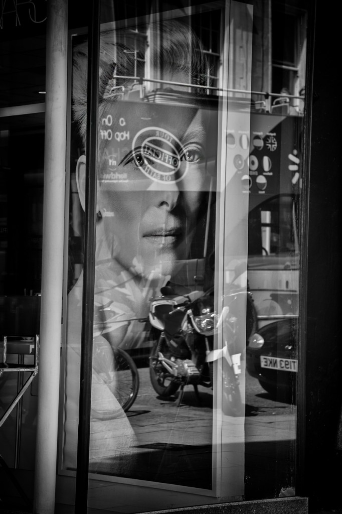 facial reflection-UK street Photography