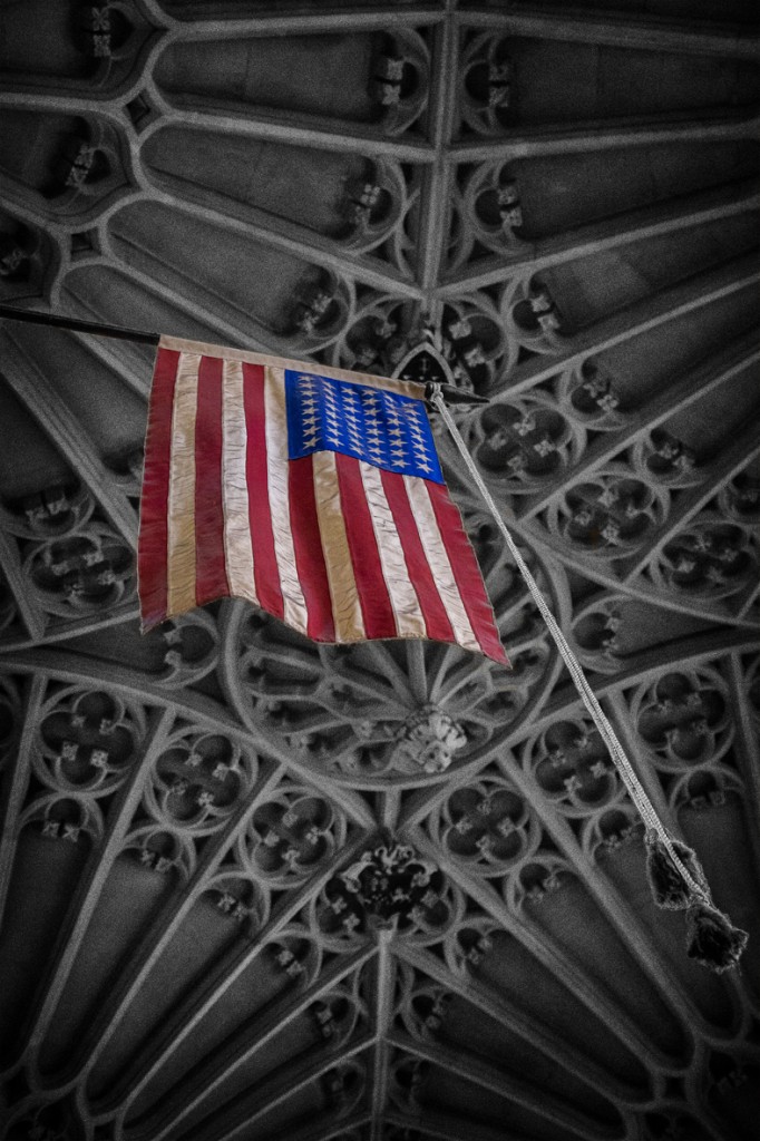 bath abbey roof and US flag - UK street Photography