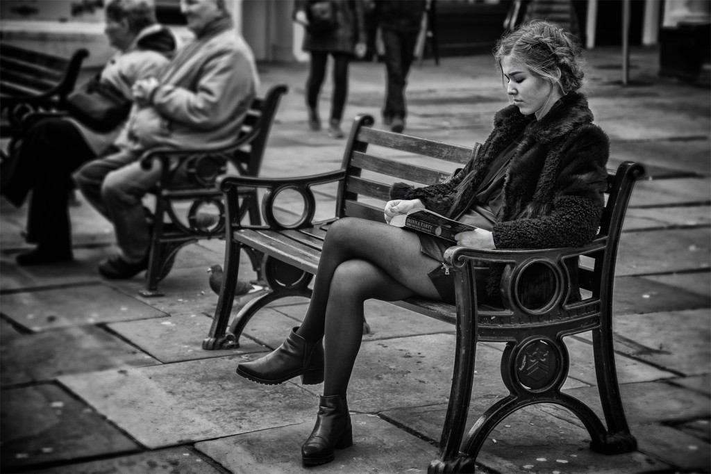 girl reading - UK street Photography